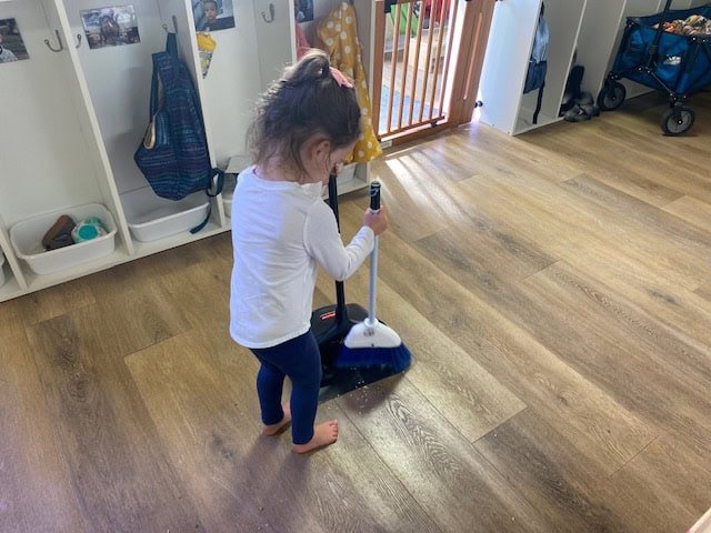 Toddler Practicing Sweeping